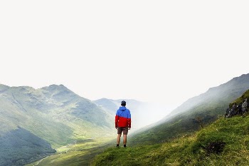 Man standing on mountain border, | Free PSD - rawpixel