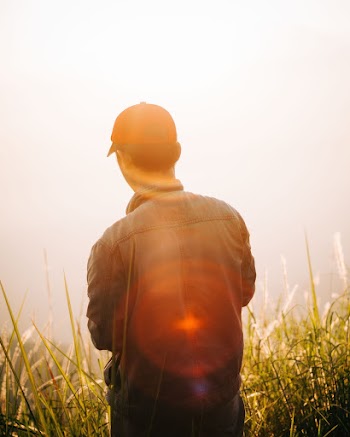Man Standing on Mountain Top