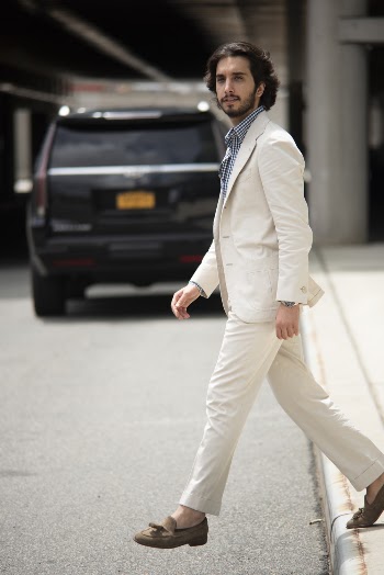 Man Standing on Paved Road