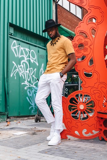 Man Standing on Pavement