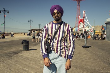 Man Standing on Pavement