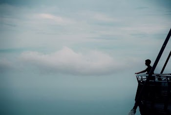 man standing on porch