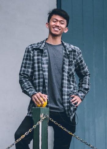 Man Standing on Rail