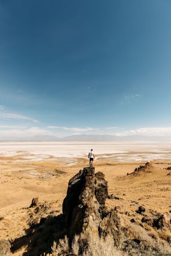 man standing on rock