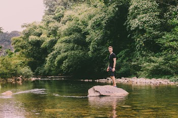 Man Standing On Rock 