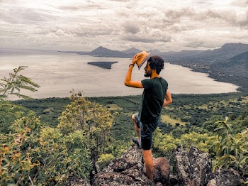 Man  Standing on Rock