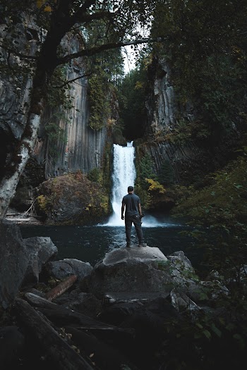 Man Standing On Rock