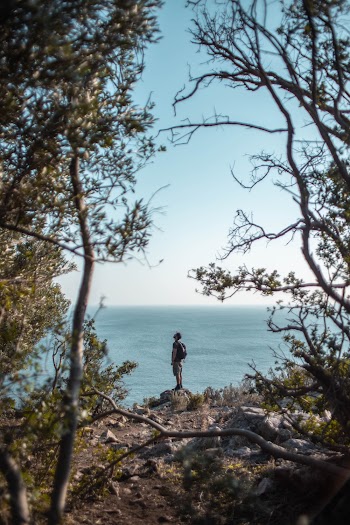 Man Standing on Rock