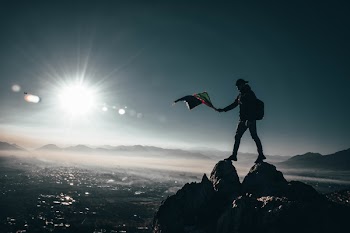 Man Standing on Rock Formation