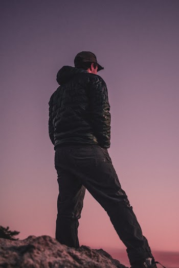 Man Standing on Rock Formation