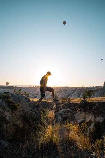 Man Standing on Rock Formation