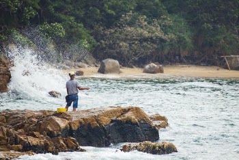 Man Standing On Rocks