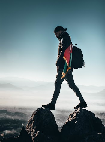 Man Standing On Rocks