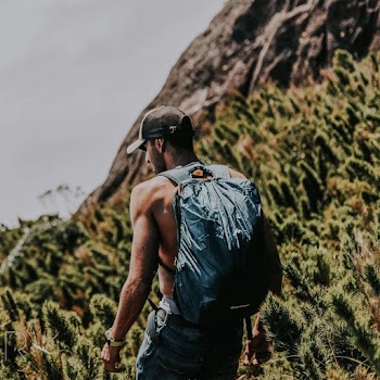 Man Standing on Rocky Mountain