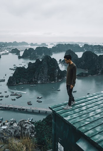 Man Standing On Roof