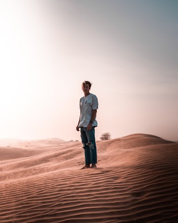Man Standing On Sand