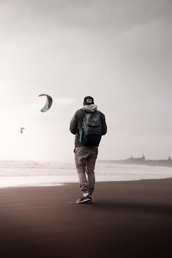 Man Standing On Seashore 