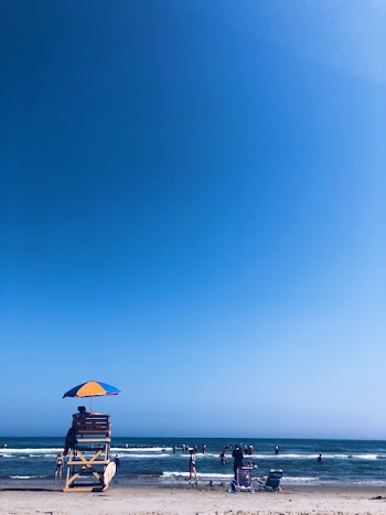 Man Standing on Seashore