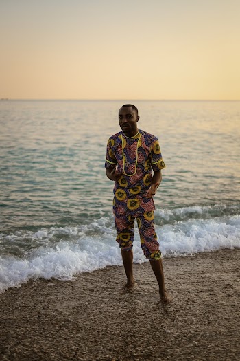 Man Standing on Seashore