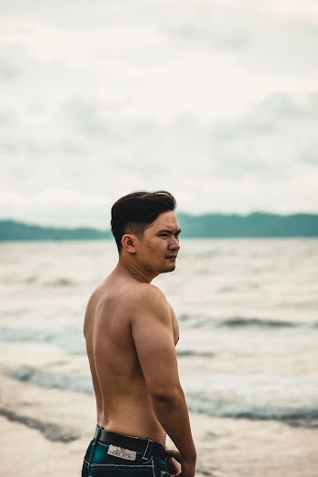 Man Standing on Seashore