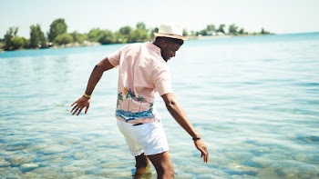 Man Standing on Seashore