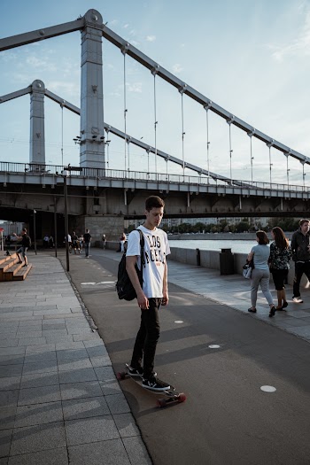 Man Standing on Skateboard