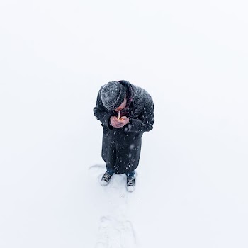 man standing on snow