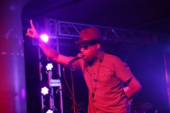 Man Standing on Stage While Taking