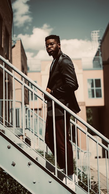 Man Standing on Staircase