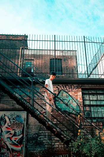 Man Standing On Staircase