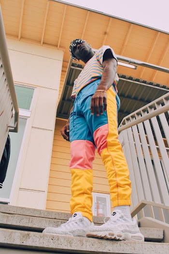 Man Standing on Stairs