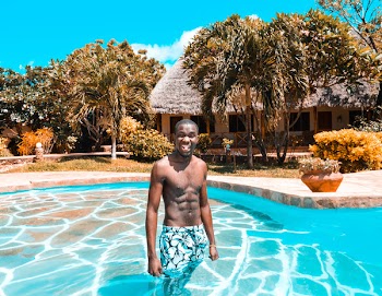 Man Standing on Swimming Pool