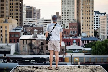 man standing on top of building at daytime