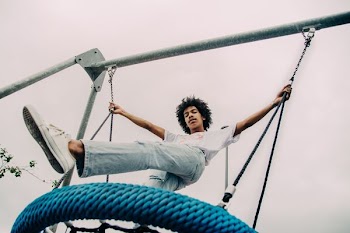 man standing on trampoline