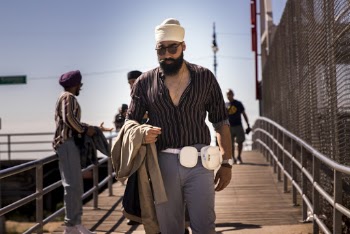Man Standing on Walkway