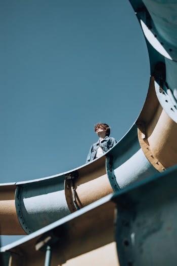 Man Standing on Waterslide Looking Up · Free Stock Photo