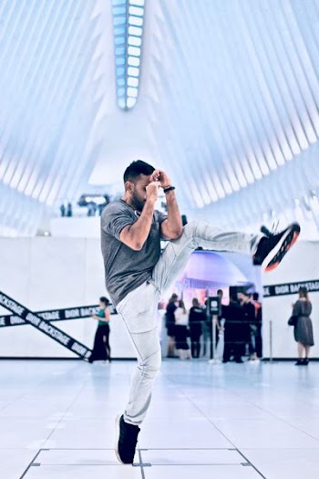 man standing tip toe