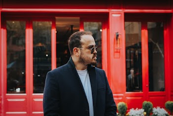 Man Standing Wearing Black Notched Lapel Blazer