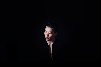 man standing wearing black top
