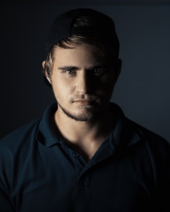 Man Standing Wearing Green Polo Shirt
