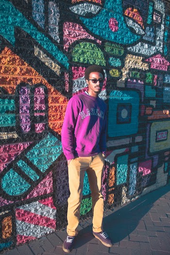 Man Standing While His Hand in His Pockets