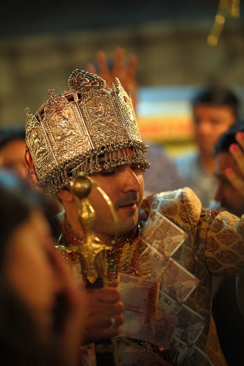 Man Standing While Holding Brass-colored Sword