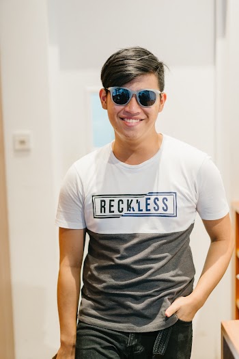 Man Standing While Wearing Sunglasses