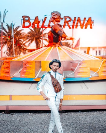 Man Standing With Balerina Statue