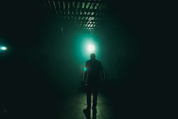Man Standing With Blue Light