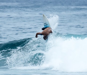 Man Surfing on Body of Water