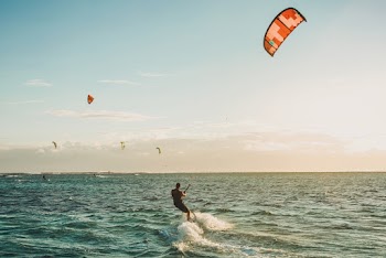 Man Surfing on Sea