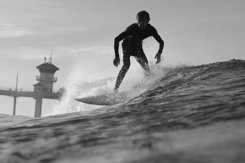 man surfing under gray sky