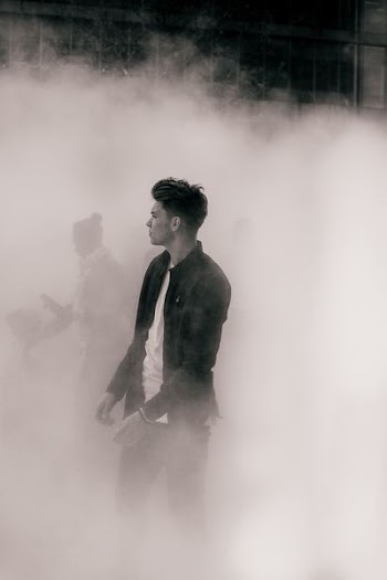 man surrounded with smoke