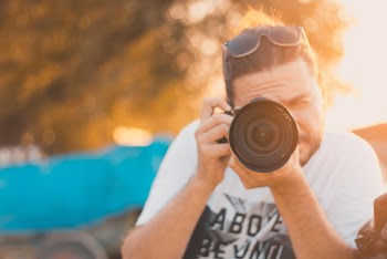 Man Takes Photo With Camera